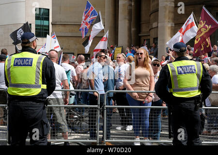 Supporter shout slogans during the rally.Supporters gathered outside BBC to demand the freedom of their jailed right-wing leader Stephen Yaxley-Lennon aka Tommy Robinson. During the rally, police had to intervene and raise their batons when a Police van was attacked by the Tommy Robinson supporters. A person was arrested after the confrontation. Stock Photo