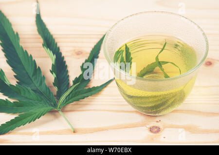 marijuana herbal tea served in glass teacup Stock Photo