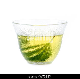 marijuana herbal tea served in glass teacup Stock Photo