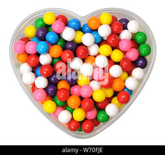 colorful gummy ball candies in heart shape bowl for Valentine day isolated on white Stock Photo