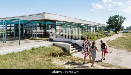 Fehmarn Germany. 26th June 2019. A family walks past the empty