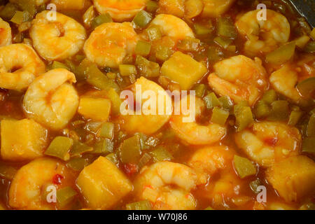 Close up background of sweet and spicy shrimp cooking in pan Stock Photo