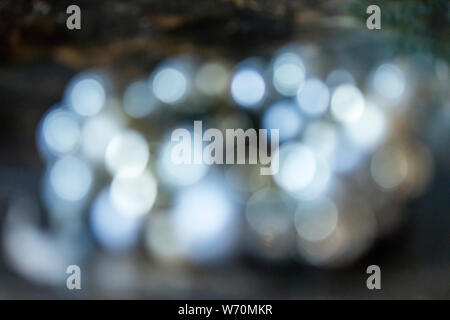 holiday and Christmas themed festive bokeh background with gold, and silver sparkles Stock Photo