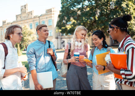 Group of students spending their break time outside. Stock Photo