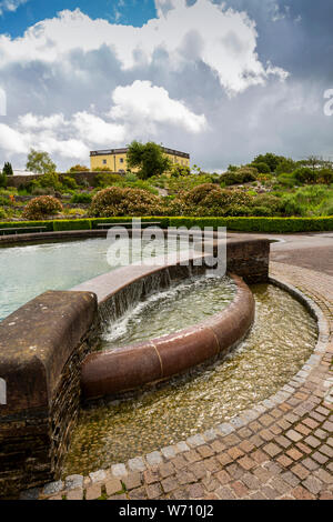 UK, Wales, Carmarthenshire, Llanarthney, National Botanic Garden of Wales, waterfall feature and floral planting near Principlity House Stock Photo