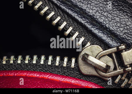 Close up stainless zipper in backpack leather. Concept of clothes or fashion. Stock Photo