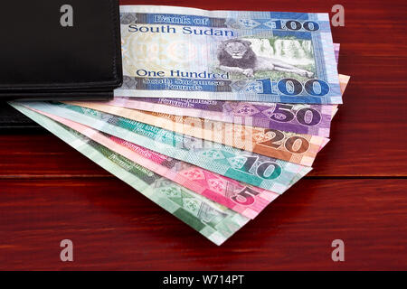 South Sudanese Pounds in the black wallet Stock Photo