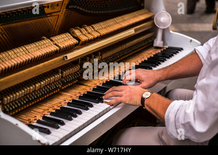 Valletta Malta, July 16 2019. Hands man playing the piano on Replubic street in Valletta,Malta Stock Photo