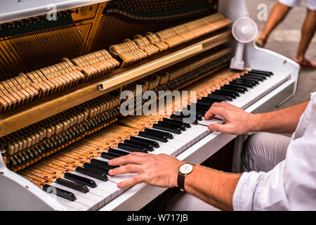 Valletta Malta, July 16 2019. Hands man playing the piano on Replubic street in Valletta,Malta Stock Photo