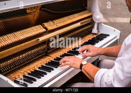 Valletta Malta, July 16 2019. Hands man playing the piano on Replubic street in Valletta,Malta Stock Photo