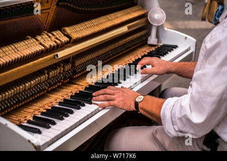 Valletta Malta, July 16 2019. Hands man playing the piano on Replubic street in Valletta,Malta Stock Photo