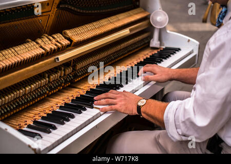 Valletta Malta, July 16 2019. Hands man playing the piano on Replubic street in Valletta,Malta Stock Photo