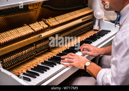 Valletta Malta, July 16 2019. Hands man playing the piano on Replubic street in Valletta,Malta Stock Photo