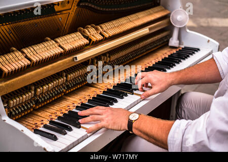 Valletta Malta, July 16 2019. Hands man playing the piano on Replubic street in Valletta,Malta Stock Photo