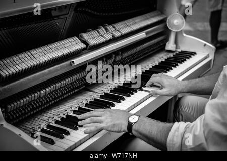 Valletta Malta, July 16 2019. Hands man playing the piano on Replubic street in Valletta,Malta Stock Photo