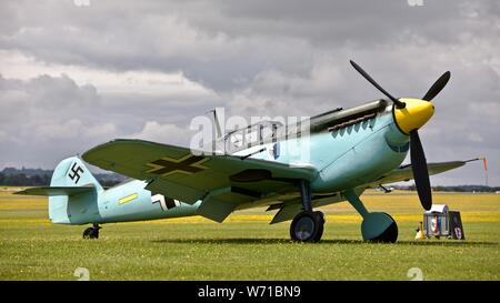 Hispano HA-1112-M4L Buchon “Yellow 7” (G-AWHM) on the Flightline at the 2019 Flying Legends Airshow at the Imperial War Museum, Duxford Stock Photo