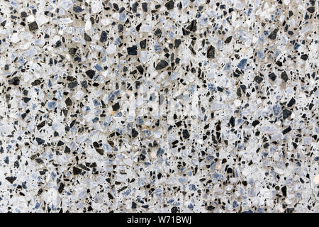 White marble terrazzo flooring pattern. Texture of mosaic floor with natural stones, granite, marble, quartz, limestone, concrete. Polished rock surfa Stock Photo