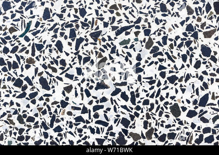 White marble terrazzo flooring pattern. Texture of mosaic floor with natural stones, granite, marble, quartz, limestone, concrete. Polished rock surfa Stock Photo