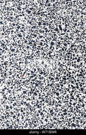 White marble terrazzo flooring pattern. Texture of mosaic floor with natural stones, granite, marble, quartz, limestone, concrete. Polished rock surfa Stock Photo