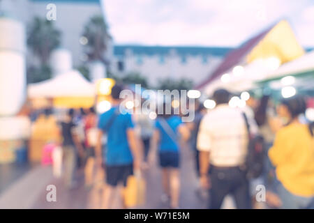 Abstract blur background in night market at shopping mall for background, Vintage toned. Stock Photo