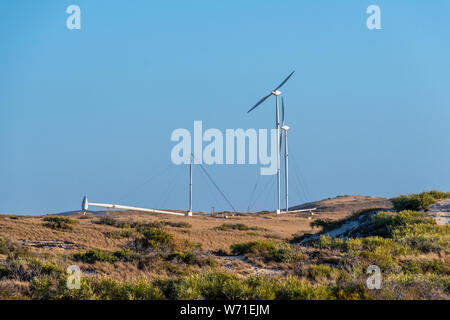 Erectable wind turbines of Coral Bay used for seawater desalination plant Stock Photo