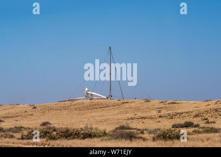 Erectable wind turbine lying flat on ground installed to desalinate salt water Stock Photo