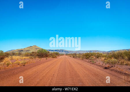 Dirt road at Karijini National Park leading towards Mount Bruce Australia Stock Photo