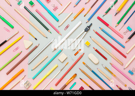 School supplies on pink paper background - top view Stock Photo