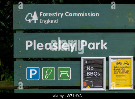 Forestry Commission England green wooden notice board 'Pleasly Park', Derbyshire. Stock Photo