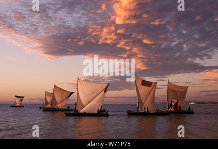 Traditional fishing pirogues with dramatic sky at sunset in Anakao, Madagascar Stock Photo