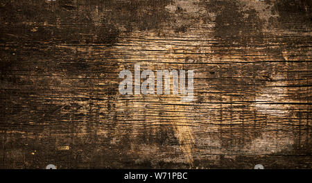 Old dark shabby boards with rusty nails. Selective focus. Stock Photo
