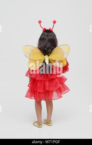 Girl pretending to be a butterfly Stock Photo