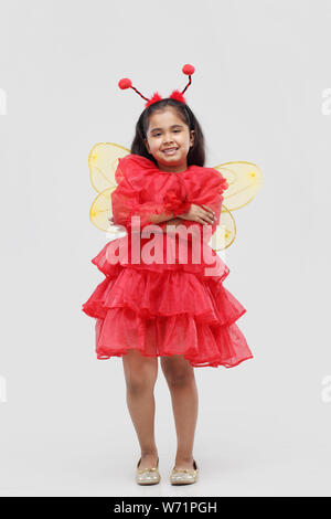 Girl pretending to be a butterfly Stock Photo