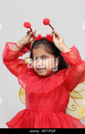 Girl pretending to be a butterfly Stock Photo