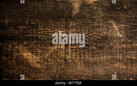Old dark shabby boards with rusty nails. Selective focus. Stock Photo
