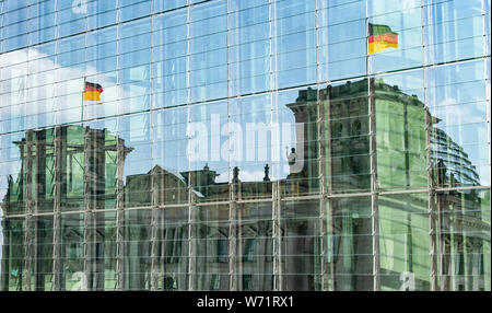 Berlin, Germany. 04th Aug, 2019. The Reichstag is reflected in the glass facade of the Marie-Elisabeth-Lüders-Haus. Credit: Paul Zinken/dpa/Alamy Live News Stock Photo