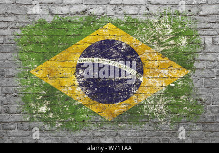 Grunge distressed flag of Brazil painted on old weathered grey brick wall Stock Photo