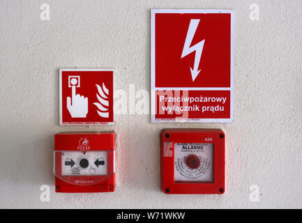 Cracow. Poland. Fire alarm devices on the wall inside the building. Pull box. Stock Photo
