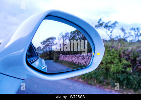 Drivers view of wing mirror on a Bentley Continental GTC Supersport car Stock Photo