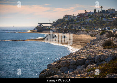 NOVEMBER 21, 2017 - FUENGIROLA, SPAIN. Looking along the beach with just a few fishermen. Stock Photo