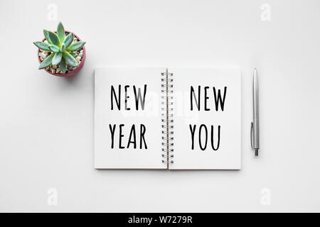 New year new you text on notepad with office accessories.Business motivation,inspiration concepts Stock Photo