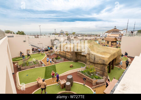 Bournemouth, UK. 4th August 2019. Tourist try out the new Smugglers Cove Adventure Golf on the seafront in Bournemouth, newly opened this week. Credit: Thomas Faull/Alamy Live News Stock Photo