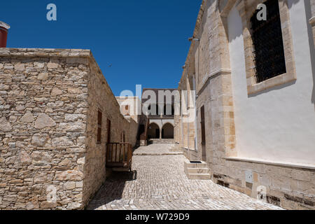 Cyprus, the quaint mountain village of Omodos (aka Omodhos) located in the Troödos Mountains. Historic Holy Cross Monastery. Stock Photo