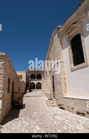 Cyprus, the quaint mountain village of Omodos (aka Omodhos) located in the Troödos Mountains. Historic Holy Cross Monastery. Stock Photo