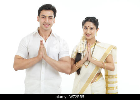 South Indian couple welcoming with hands joined Stock Photo