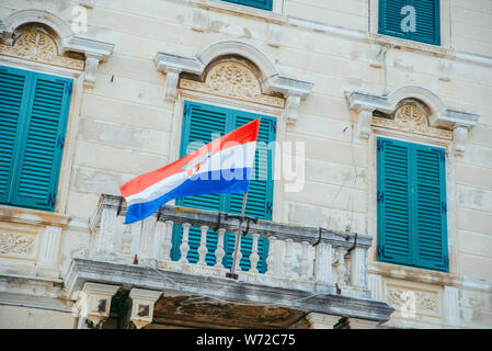 croatian flag on old building balcony. summer vacation Stock Photo