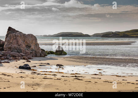 sandy beach with dune grass in Scotland, Isle of Lewis at low tide Stock Photo