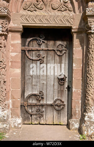 Ornate wooden south door. Church of St Mary and St David, Kilpeck, Herefordshire Stock Photo
