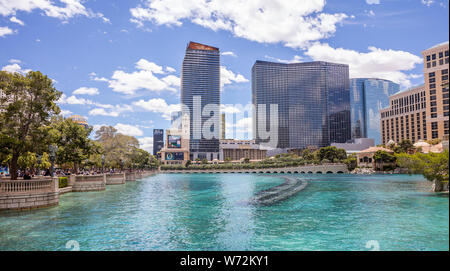Las Vegas Nevada, USA. May 27, 2019. Bellagio pool fountain and buildings in the morning. Sunny spring day, blue sky