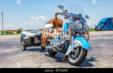 USA Texas, May 13th, 2019. Custom motorbike blue color with trailer and leather details, parked outdoors in a sunny spring day near Amarillo, closeup Stock Photo